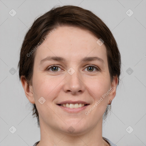 Joyful white young-adult female with medium  brown hair and grey eyes