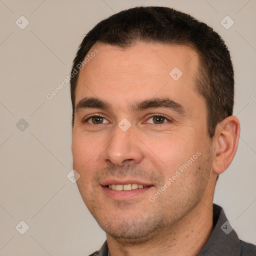 Joyful white young-adult male with short  brown hair and brown eyes