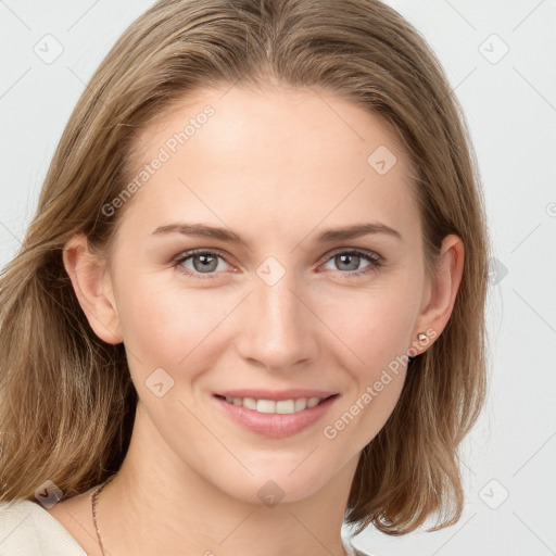 Joyful white young-adult female with long  brown hair and blue eyes