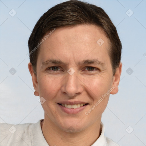 Joyful white adult male with short  brown hair and brown eyes