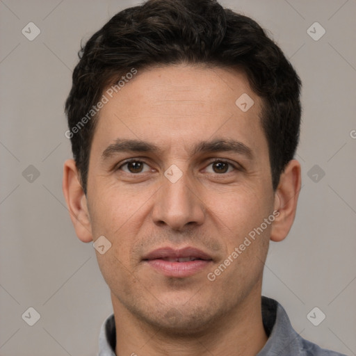 Joyful white adult male with short  brown hair and brown eyes