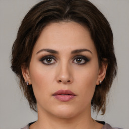 Neutral white young-adult female with medium  brown hair and brown eyes