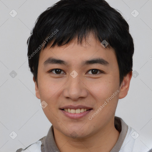 Joyful asian young-adult male with short  black hair and brown eyes