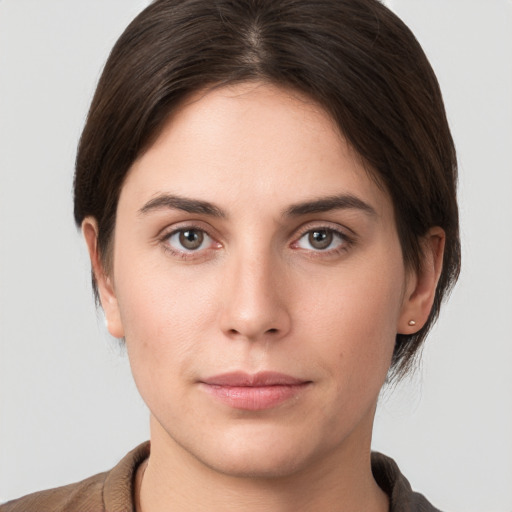 Neutral white young-adult female with short  brown hair and brown eyes