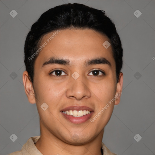 Joyful latino young-adult male with short  black hair and brown eyes