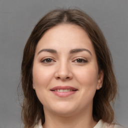 Joyful white young-adult female with medium  brown hair and brown eyes