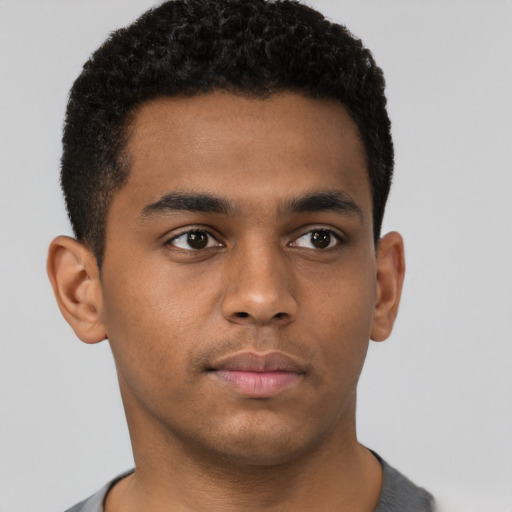 Neutral black young-adult male with short  brown hair and brown eyes