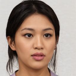 Neutral asian young-adult female with medium  brown hair and brown eyes