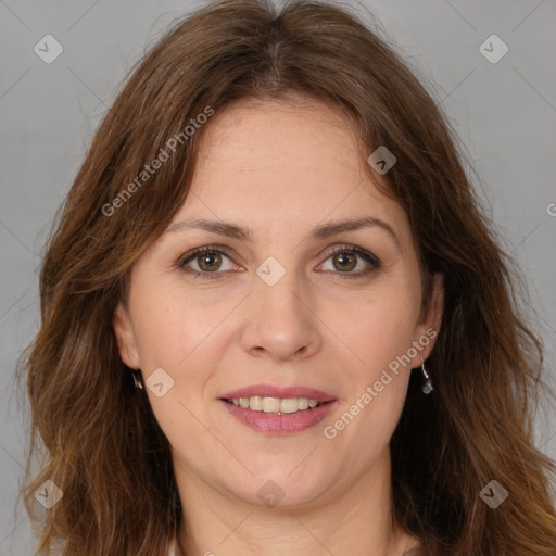 Joyful white adult female with long  brown hair and brown eyes