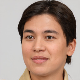 Joyful white young-adult male with medium  brown hair and brown eyes