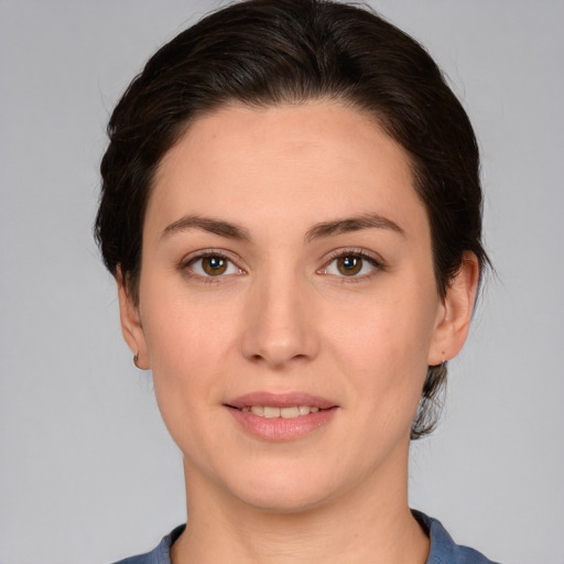 Joyful white young-adult female with medium  brown hair and brown eyes