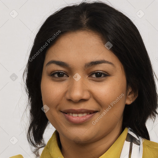 Joyful latino young-adult female with medium  brown hair and brown eyes