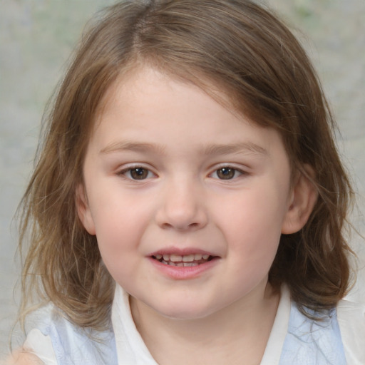 Joyful white child female with medium  brown hair and brown eyes