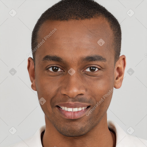 Joyful black young-adult male with short  brown hair and brown eyes