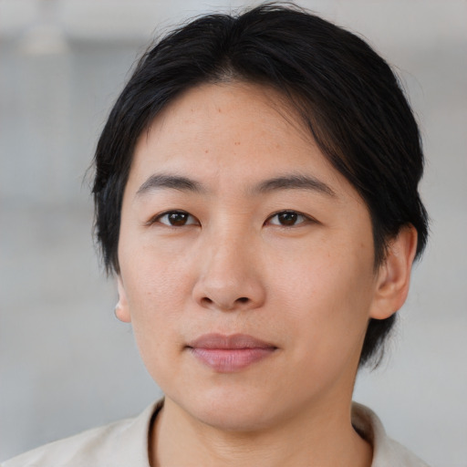 Neutral asian young-adult female with medium  brown hair and brown eyes