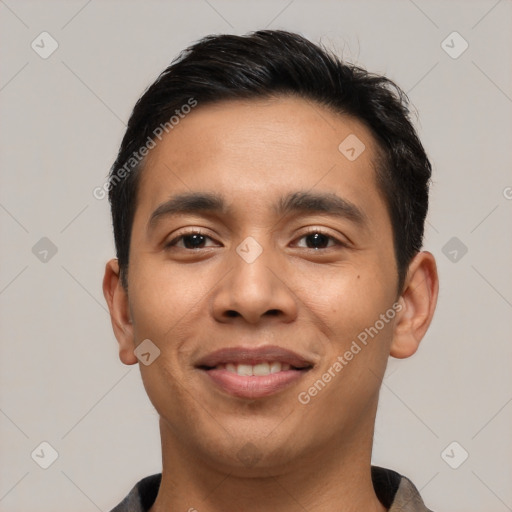 Joyful asian young-adult male with short  black hair and brown eyes