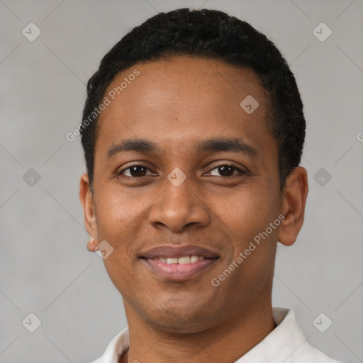 Joyful latino young-adult male with short  black hair and brown eyes