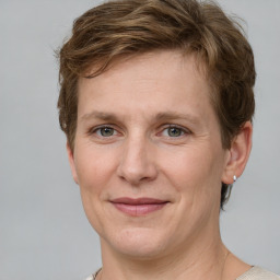 Joyful white adult female with short  brown hair and grey eyes