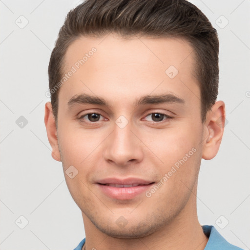 Joyful white young-adult male with short  brown hair and brown eyes