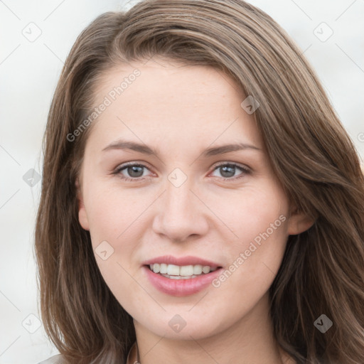 Joyful white young-adult female with long  brown hair and grey eyes