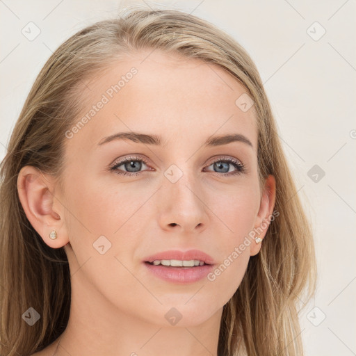 Joyful white young-adult female with long  brown hair and blue eyes