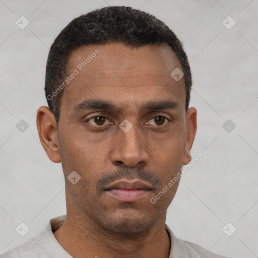 Neutral black young-adult male with short  black hair and brown eyes