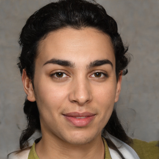 Joyful white young-adult female with medium  black hair and brown eyes