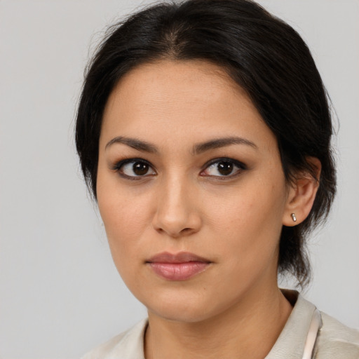 Neutral latino young-adult female with medium  brown hair and brown eyes