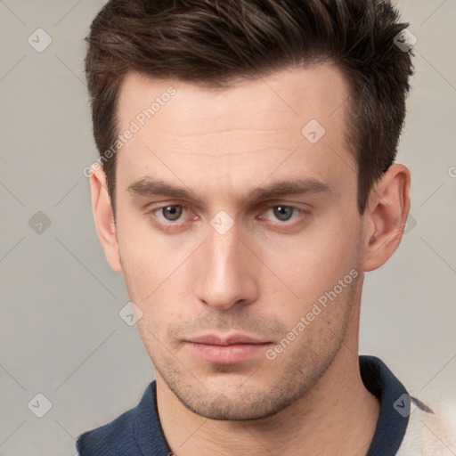 Neutral white young-adult male with short  brown hair and grey eyes