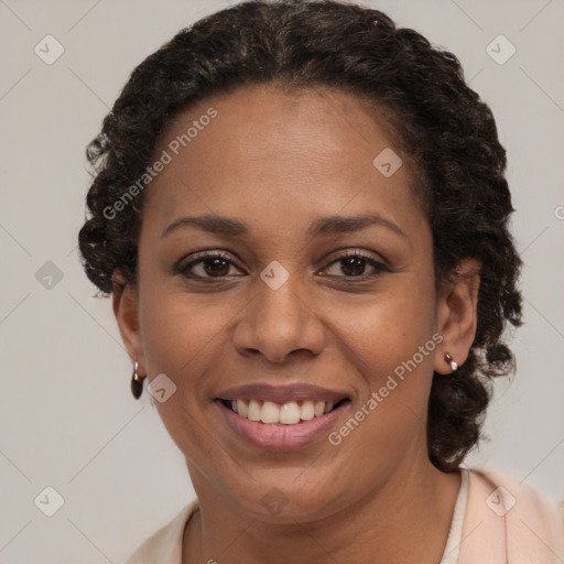 Joyful black adult female with short  brown hair and brown eyes