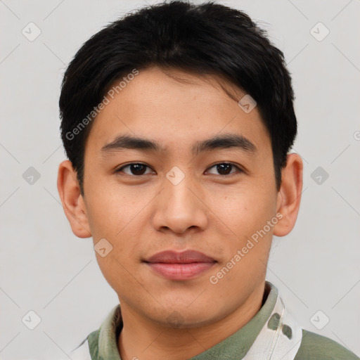 Joyful asian young-adult male with short  brown hair and brown eyes