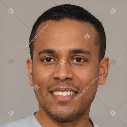 Joyful latino young-adult male with short  black hair and brown eyes