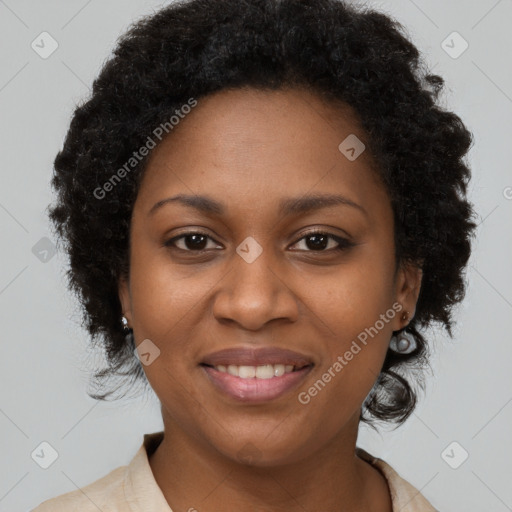 Joyful black young-adult female with long  brown hair and brown eyes