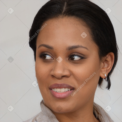 Joyful black young-adult female with medium  brown hair and brown eyes