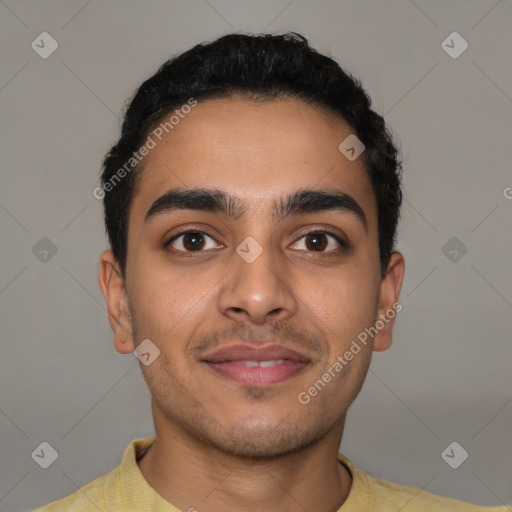 Joyful latino young-adult male with short  brown hair and brown eyes