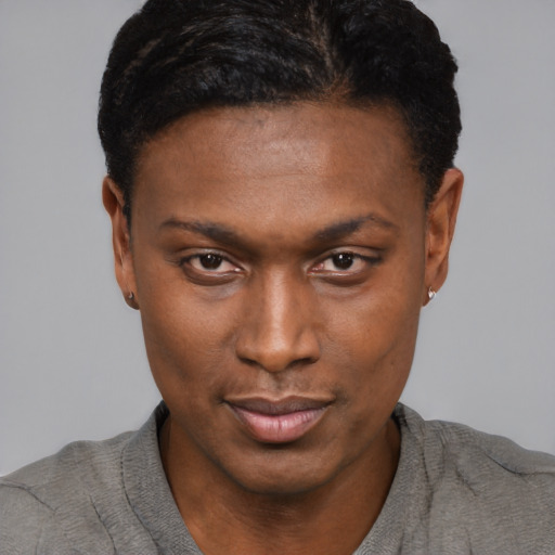 Joyful black young-adult male with short  brown hair and brown eyes