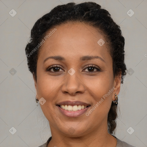 Joyful latino adult female with short  brown hair and brown eyes