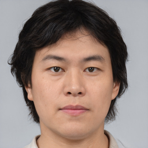 Neutral asian young-adult male with medium  brown hair and brown eyes