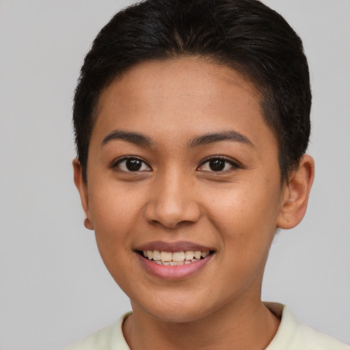 Joyful asian young-adult female with short  brown hair and brown eyes