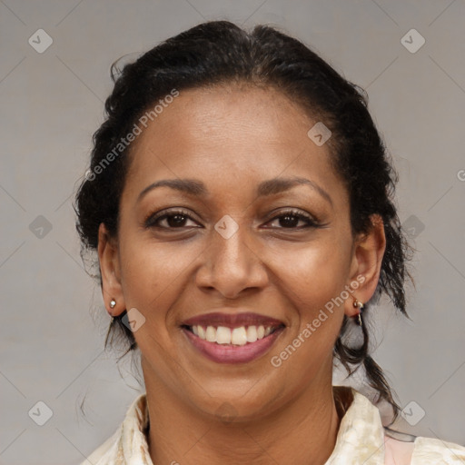 Joyful black adult female with medium  brown hair and brown eyes