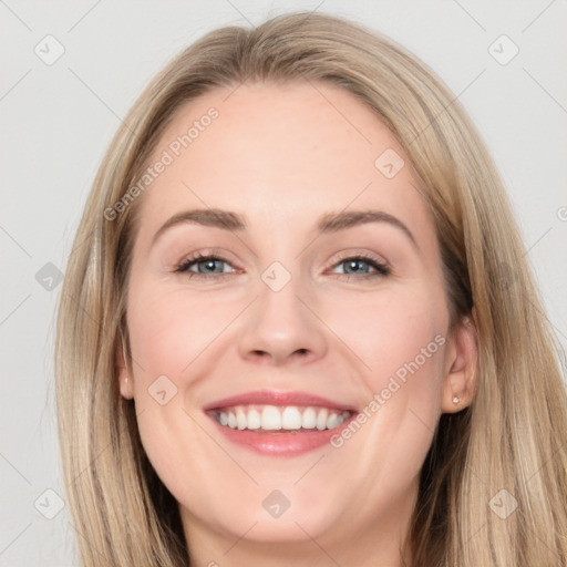 Joyful white young-adult female with long  brown hair and grey eyes