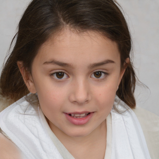 Joyful white child female with medium  brown hair and brown eyes