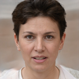 Joyful white adult female with short  brown hair and brown eyes