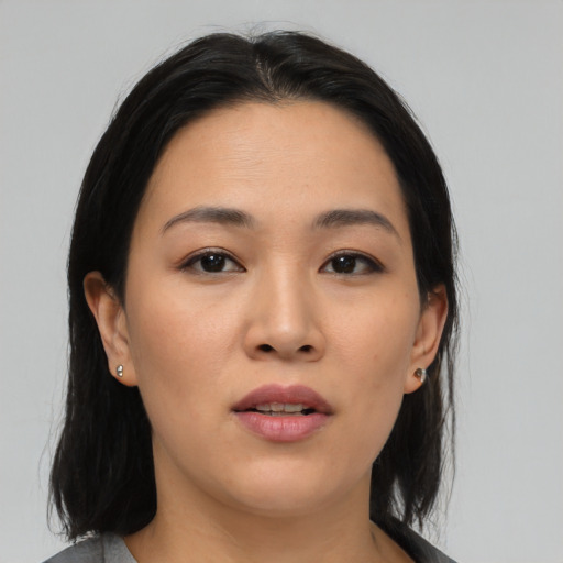 Neutral asian young-adult female with medium  black hair and brown eyes