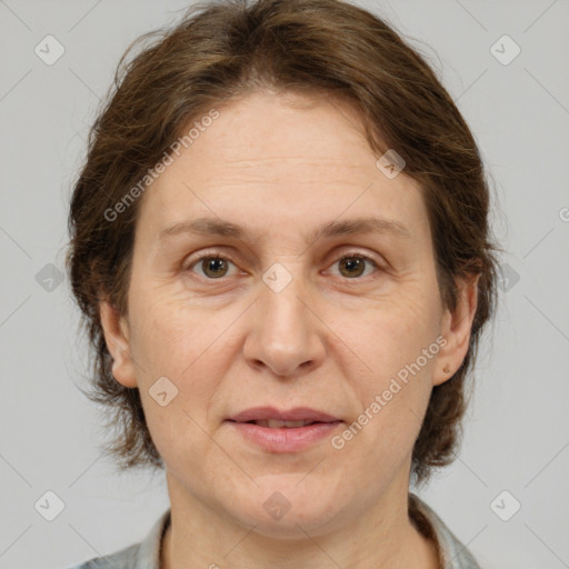 Joyful white adult female with medium  brown hair and grey eyes