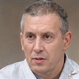 Neutral white middle-aged male with short  black hair and brown eyes