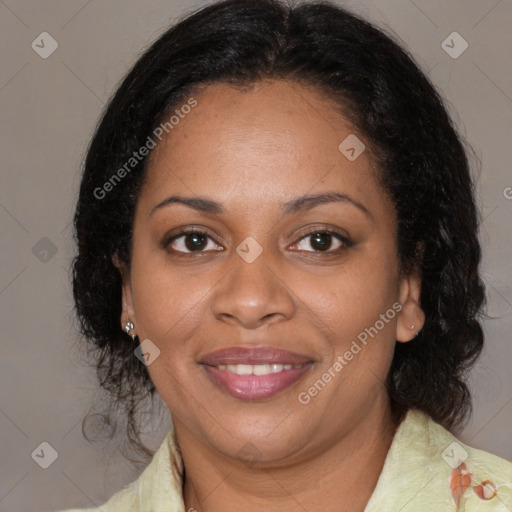 Joyful black adult female with medium  brown hair and brown eyes