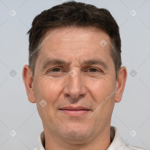 Joyful white adult male with short  brown hair and brown eyes