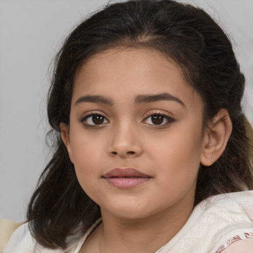 Joyful white child female with medium  brown hair and brown eyes