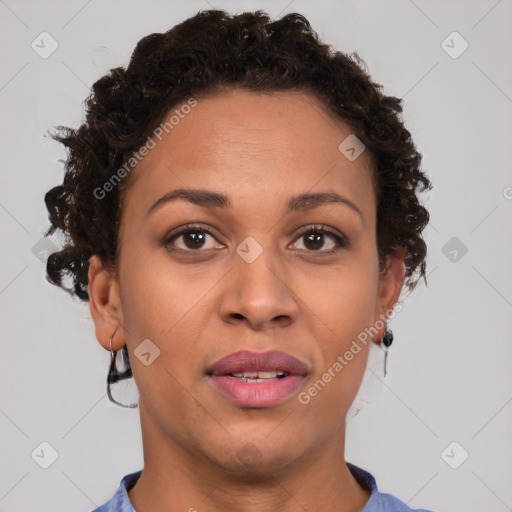 Joyful black adult female with short  brown hair and brown eyes